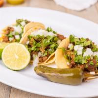Regular Taco · Two regular tortilla , Choice of meat, onion and cilantro.