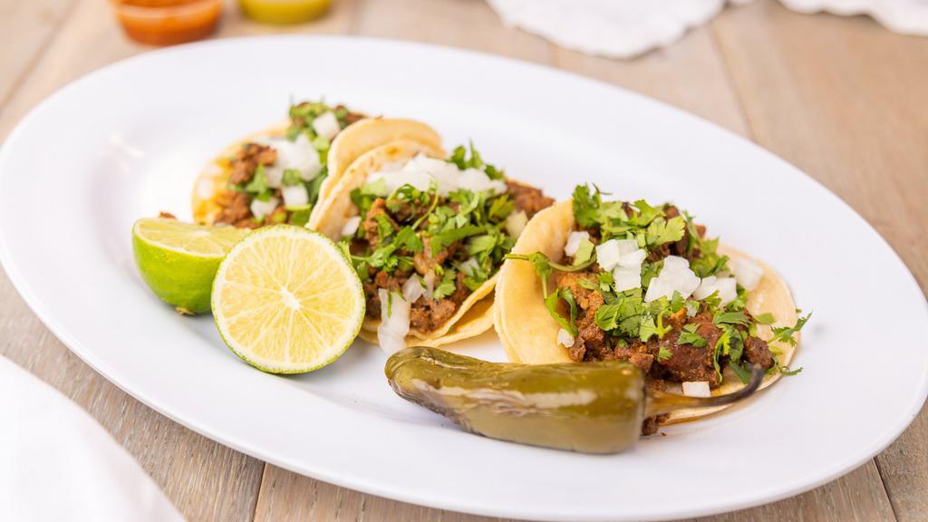 Regular Taco · Two regular tortilla , Choice of meat, onion and cilantro.
