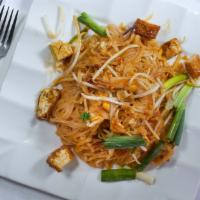 66. Pad Thai · Stir fried rice noodle with grounded peanut, egg, leek, tofu, bean sprout in sweet Thai tama...