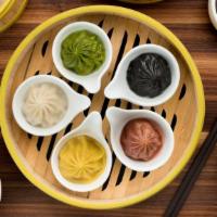 Palette Soup Dumplings | 彩籠小籠包 (xlb) (5) · spinach & kale, paprika & chicken, turmeric & crab roe, red beet & beef, squid ink & black t...