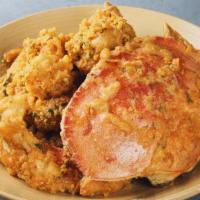 Salted Egg Yolk Dungeness Crab | 香草金沙大蟹 · crispy fried coated in salty egg yolk & basil. Contains shellfish.