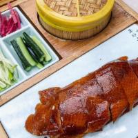 Half Peking Duck | 北京片皮鴨 · roast duck with crispy skin, momo wrappers, & palette condiments