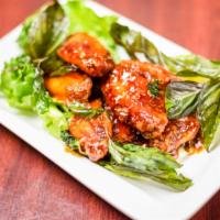 9. Bangkok Chicken Wings · Deep-fried chicken wings with chili garlic sauce and crispy basil.