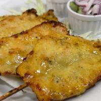 2. Chicken Satay · Marinated chicken with fresh herbs and spices, grilled, served with cucumber salad and peanu...