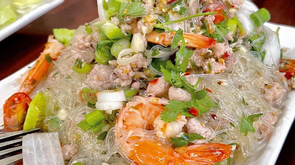 13. Silver Noodle Salad · Tasty silver noodles, ground pork, shrimp, mushroom, onions, chili, and lemon dressing.