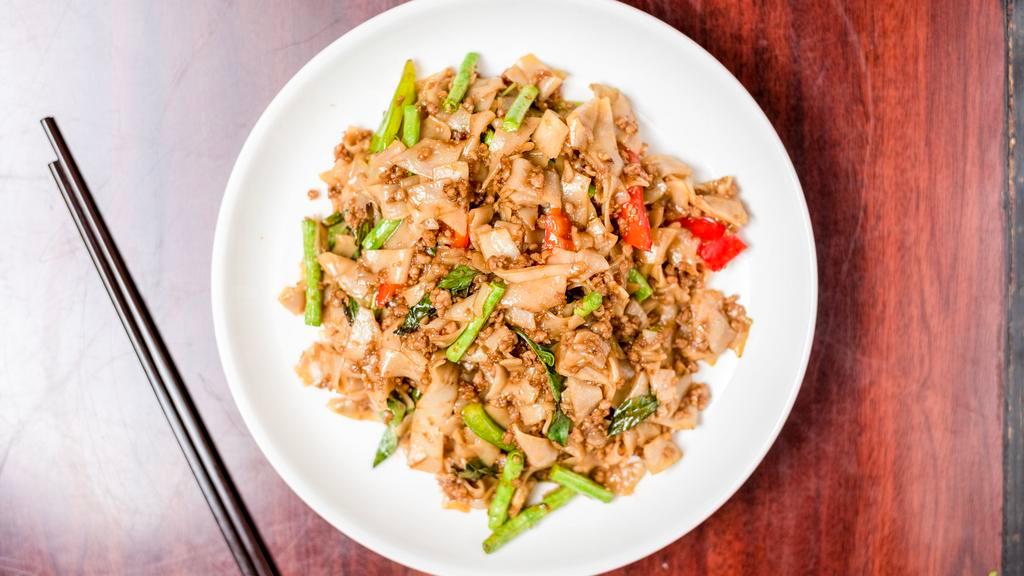 31. Pad Kee Mao (Tofu) · Stir-fried flat rice noodles with green bean, bell pepper, chili, and basil.
