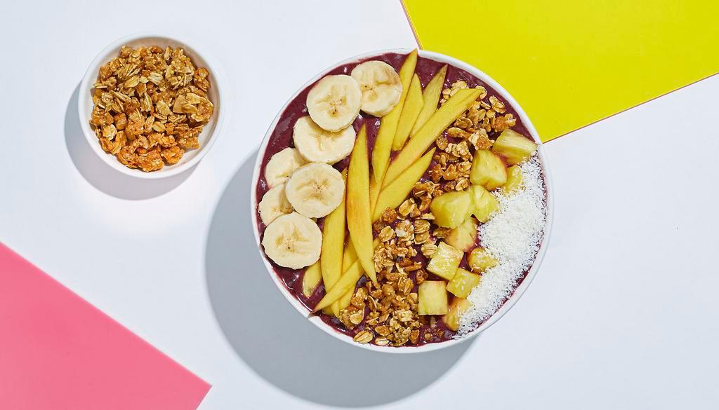 Tropical Acai Bowl · Refreshing acai blend topped with granola, banana, pineapple, mango, and shredded coconut.