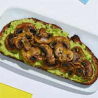 Mushroom Avocado Toast · Smashed avocado on whole wheat toast topped with sauteed mushrooms and chives.