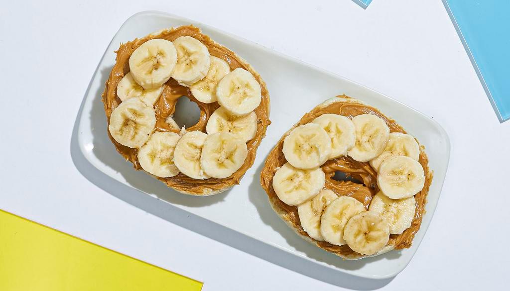 Peanut Butter Banana Bagel · A toasted bagel topped with creamy peanut butter and banana slices.