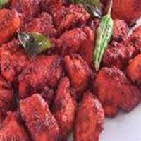 Chicken 65 · Boneless chicken marinated in a spicy masala and deep fried, garnished with onion and lemon ...