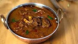 Goat Curry · A traditional mildly spiced Indian curry with tender pieces of goat.