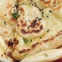 Plain Naan · Vegetarian.  Traditional Indian bread baked in clay oven.