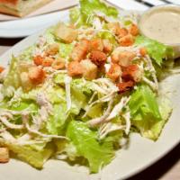 Chicken Caesar Salad · Crisp romaine lettuce tossed in Caesar dressing topped with chicken.