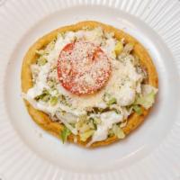 Sopes · 2 handmade sopes topped with beans, lettuce, sour cream, green salsa, and cheese