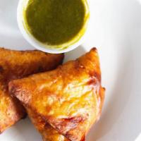 5. Samosa (2 Pc) · Vegan. Deep fried pastry stuffed with mildly spiced potatoes and green peas. Served with hom...