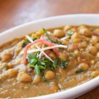 10. Chana Masala · Vegan. Garbanzo beans cooked with fresh tomatoes, ginger, garlic, coriander, bay leaves and ...