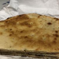 3. Naan · Fresh baked bread in tandoori oven.