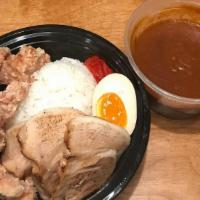 Combo Curry · boneless fried chicken, chashu pork, half-boiled egg, red pickles over rice. curry sauce side.