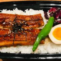 Regular Unagi Don · Simmered Eel over Rice, peppers, half-boiled egg, and pickles (contains sesame seeds), fresh...