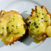 Chicken Waffle Benedict · Half waffle with crispy chicken breasts poached eggs and hollandaise.