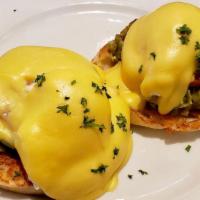 California Benedict · Ripe avocado and fresh tomato, poached eggs and hollandaise sauce on an English muffin.