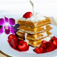 Cheesecake Waffle · Crisp warm waffle filled with sweet cream cheese and fresh strawberry syrup