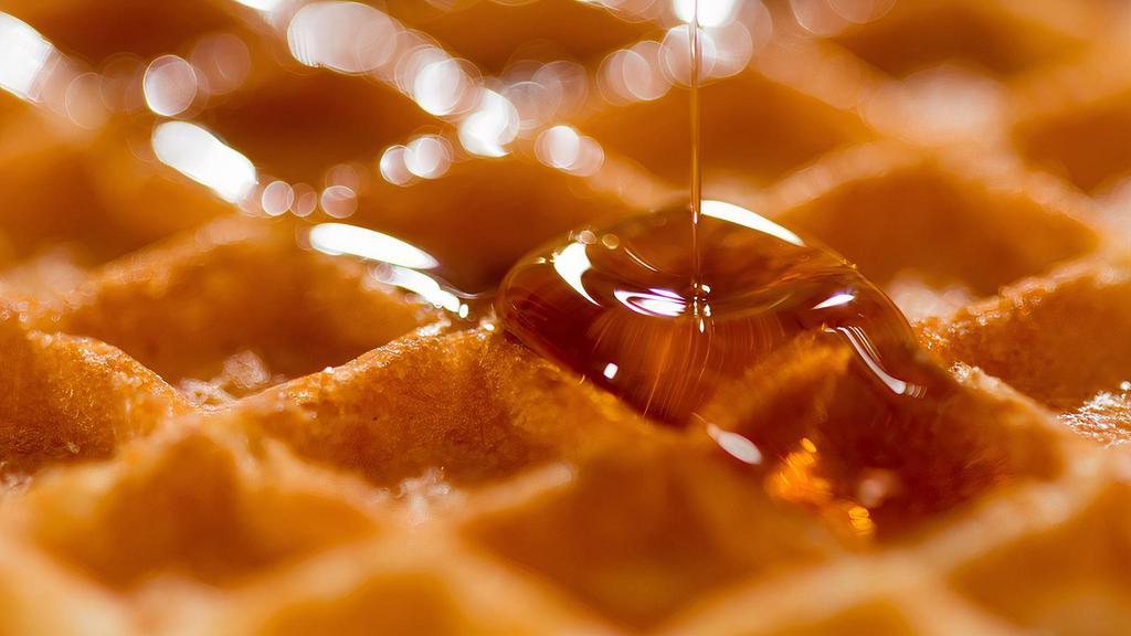 Belgian Waffle · Crisp warm waffle served with syrup and butter.