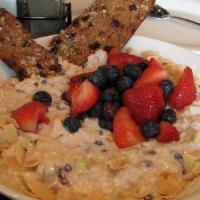 Berry Oatmeal Bowl · Warm oatmeal topped with fresh blueberries, strawberries, and brown sugar.