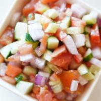 #11. Salad Shirazi · Finely diced cucumbers, onions and tomatoes, mixed with our house dressing (olive oil, garli...