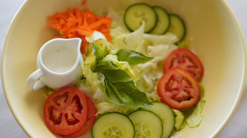 #12. Garden Salad · A fine blend of fresh tomatoes, carrots, cucumbers and lettuce with our delicious house ranch-dressing.
