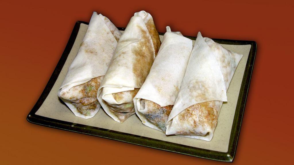 Mu Shu Chicken Rolls · Chicken, cabbage, wood ear mushrooms, bamboo shoots, and egg wrapped in thin pancakes.