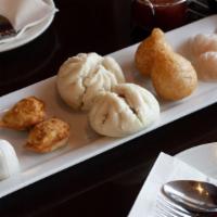 Appetizer Sampler · Two of each: bok choy shrimp dumplings, Chaozhou crab cake, Ha Gao , crab puffs, and steamed...