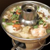 Tamarind Seafood Hot Pot · Shrimp, catfish filet, calamari, and vegetables in tamarind broth.