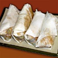 Mu Shu Vegetarian Chicken Rolls · Vegetarian chicken, cabbage, mushrooms, bamboo shoots wrapped in a thin pancake.