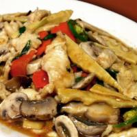 Basil Chicken · Stir fried chicken with garlic, bamboo shoots, shiitake mushrooms, basil, and scallions.