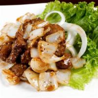 Shaking Beef · Filet mignon tossed with onion and black pepper.