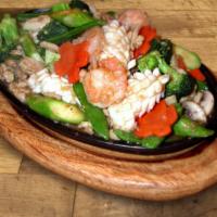 Three Delights Sizzling Plate · Stir fried calamari, chicken, shrimp, asparagus, snow peas, mushrooms, and broccoli.