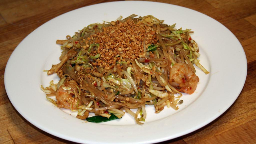 Pad Thai · Stir fried shrimp, chicken, egg, cabbage, bean sprouts, scallions, and rice noodles topped with peanuts.