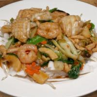 Saigon Street Chow Fun · Sautéed shrimp, calamari, chicken, and assorted vegetables over chow fun noodles.