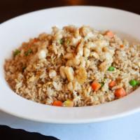 Chicken Fried Rice · Stir fried rice, egg, scallions, peas, and carrots with chicken.