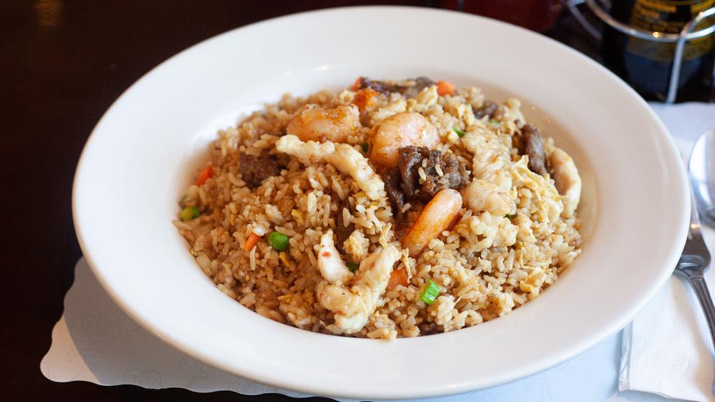 Combination Fried Rice · Stir fried rice, egg, scallions, peas, and carrots with combination.