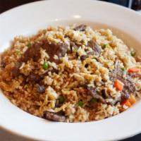 Beef Fried Rice · Stir fried rice, egg, scallions, peas, and carrots with beef.
