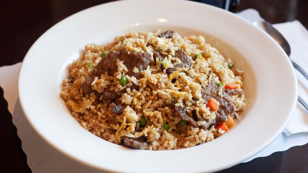 Beef Fried Rice · Stir fried rice, egg, scallions, peas, and carrots with beef.