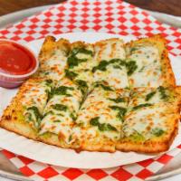 Garlic Bread · Toasted homemade bread with our own garlic sauce.