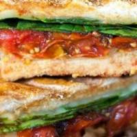 Veggie Sandwich Panini · Spinach, tomatoes, pesto sauce, roasted peppers, onions, olives & artichokes.