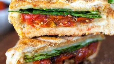 Veggie Sandwich Panini · Spinach, tomatoes, pesto sauce, roasted peppers, onions, olives & artichokes.