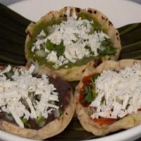 PICADAS TRÍO  3PIECE  · Fresh hand-made corn tortillas topped with black beans, red sauce spicy or green sauce mild....