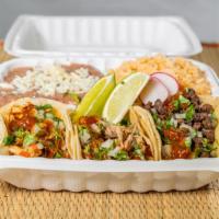 Tacos Combination Plate  · Two tac of your choice accompanied by beans and rice, toppings with onions, cilantro, lime s...