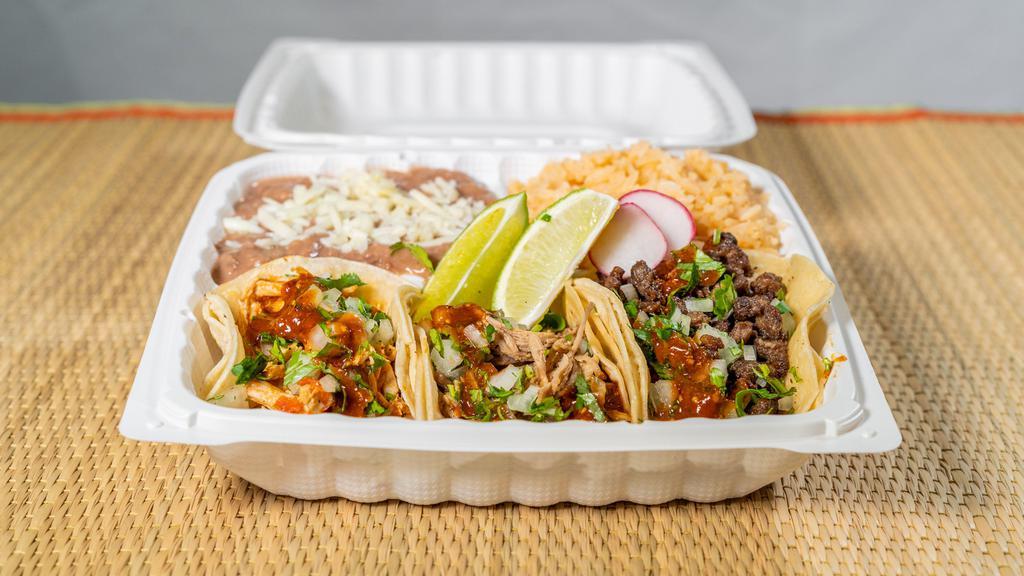 Tacos Combination Plate  · Two tac of your choice accompanied by beans and rice, toppings with onions, cilantro, lime spicy red or mild green salsa. 

Beef. Chicken. Carnitas or pastor.
