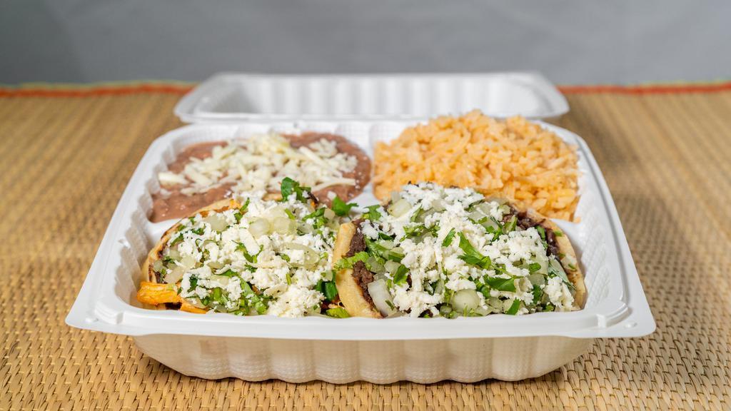 Mexitamalli's Sopes Combination Plate Lunch · Fresh hand-made corn tortilla with black beans, your choice of chicken or poblano peppers. Finished with queso fresco, sour cream and salsa.